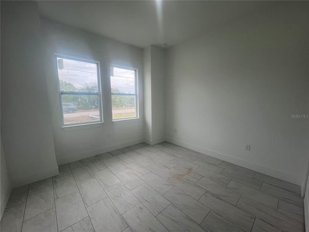 187 Sesame Road East Rotonda West, FL 33947 - Photo 24 of 28 an empty room with windows