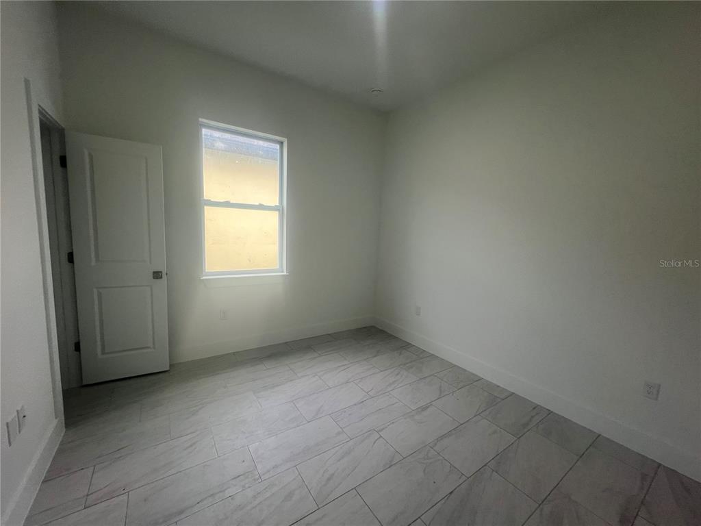 187 Sesame Road East Rotonda West, FL 33947 - Photo 26 of 28 an empty room with a window