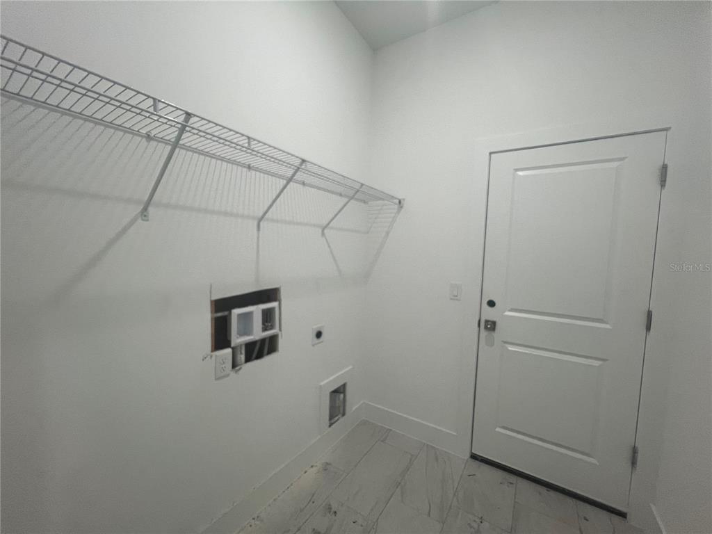 187 Sesame Road East Rotonda West, FL 33947 - Photo 28 of 28 a bathroom with a shower and cabinets