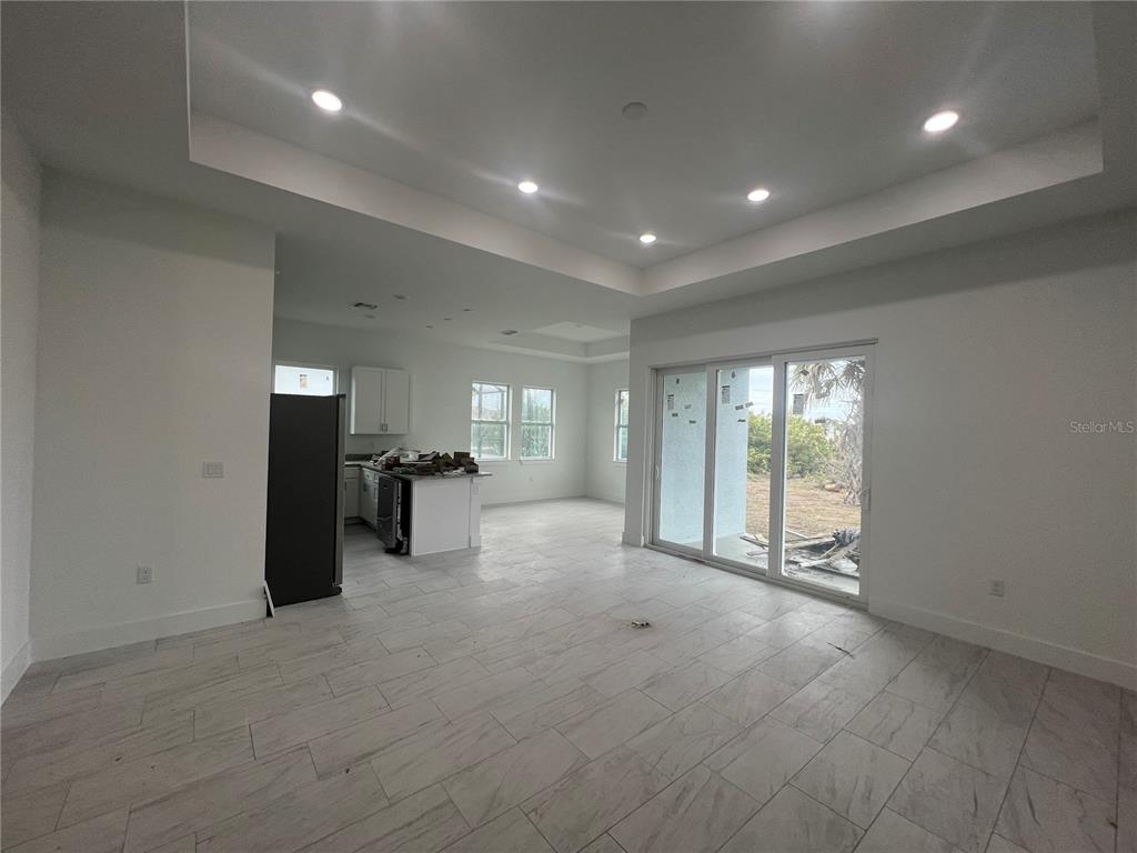 187 Sesame Road East Rotonda West, FL 33947 - Photo 3 of 28 a view of an empty room with a window