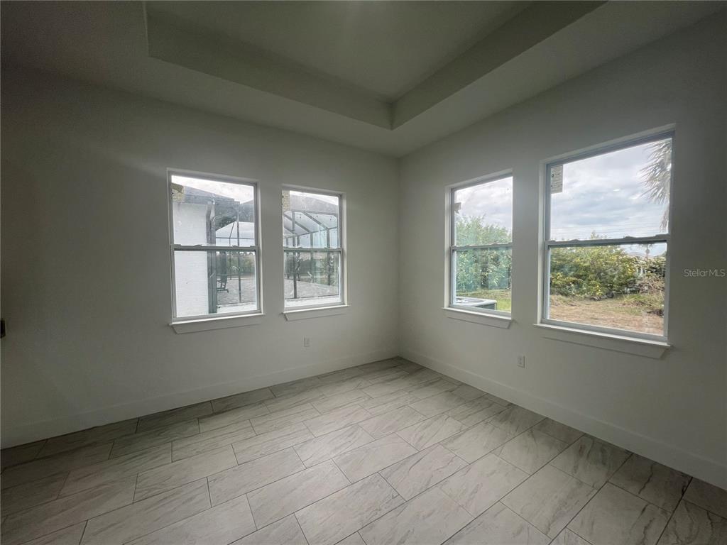 187 Sesame Road East Rotonda West, FL 33947 - Photo 5 of 28 an empty room with windows