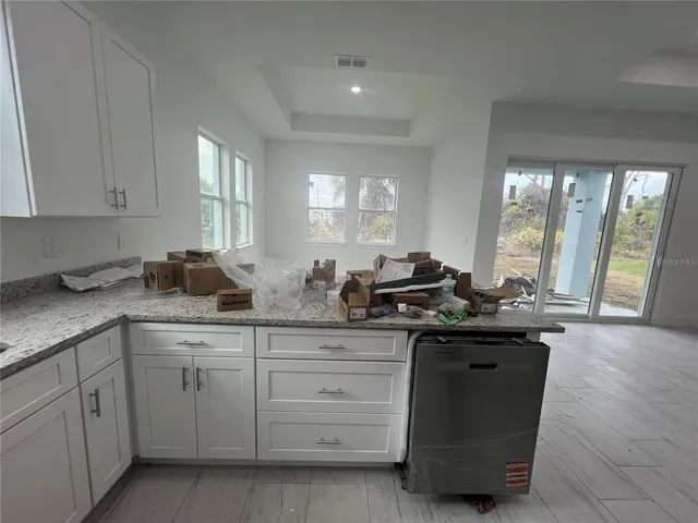 a view of an empty room with a large window