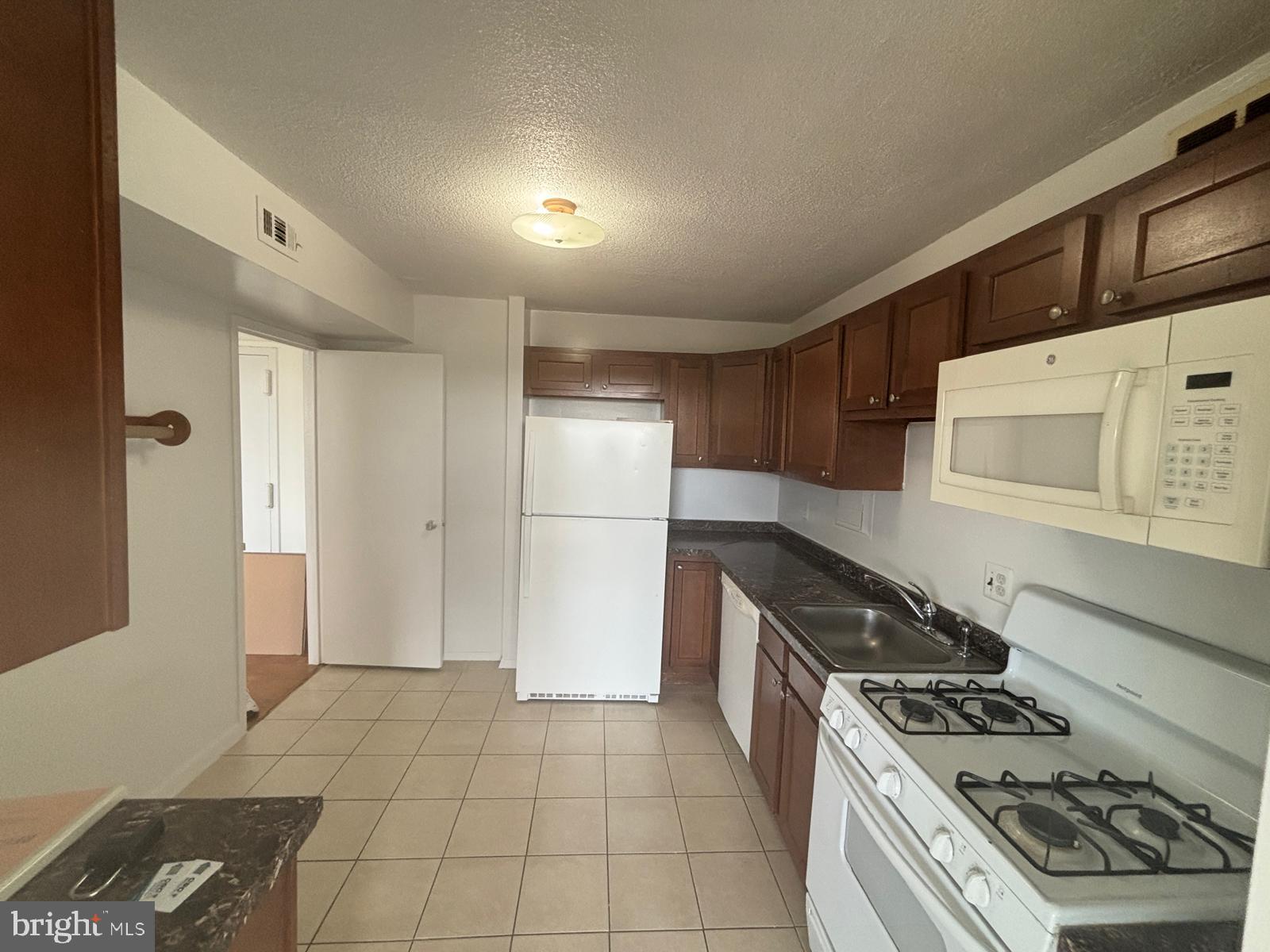1836 Metzerott Road, Unit 1720 Hyattsville, MD 20783 - Photo 13 of 35 Cozy kitchen with modern amenities.