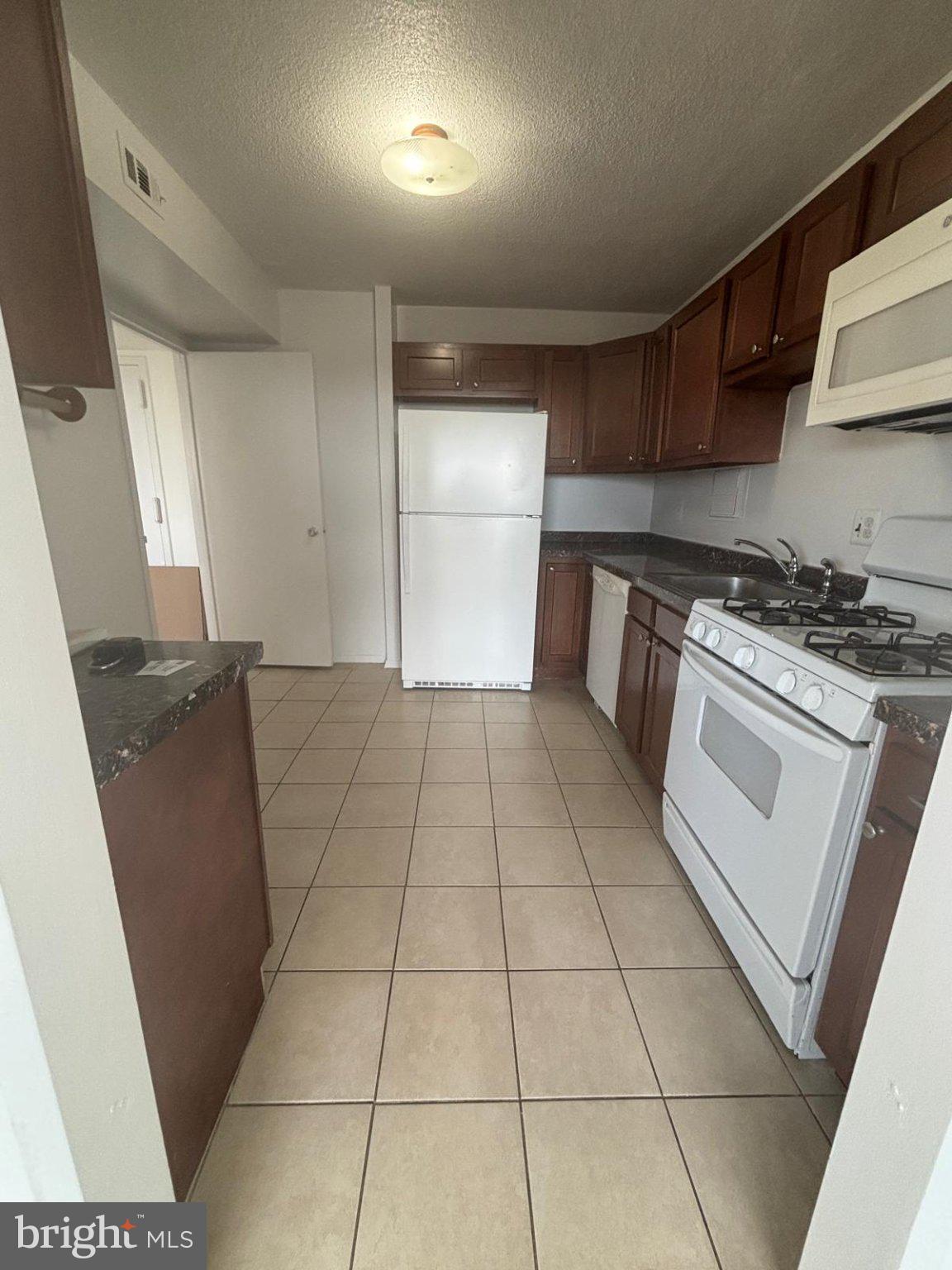 1836 Metzerott Road, Unit 1720 Hyattsville, MD 20783 - Photo 14 of 35 Modern kitchen with ample space.