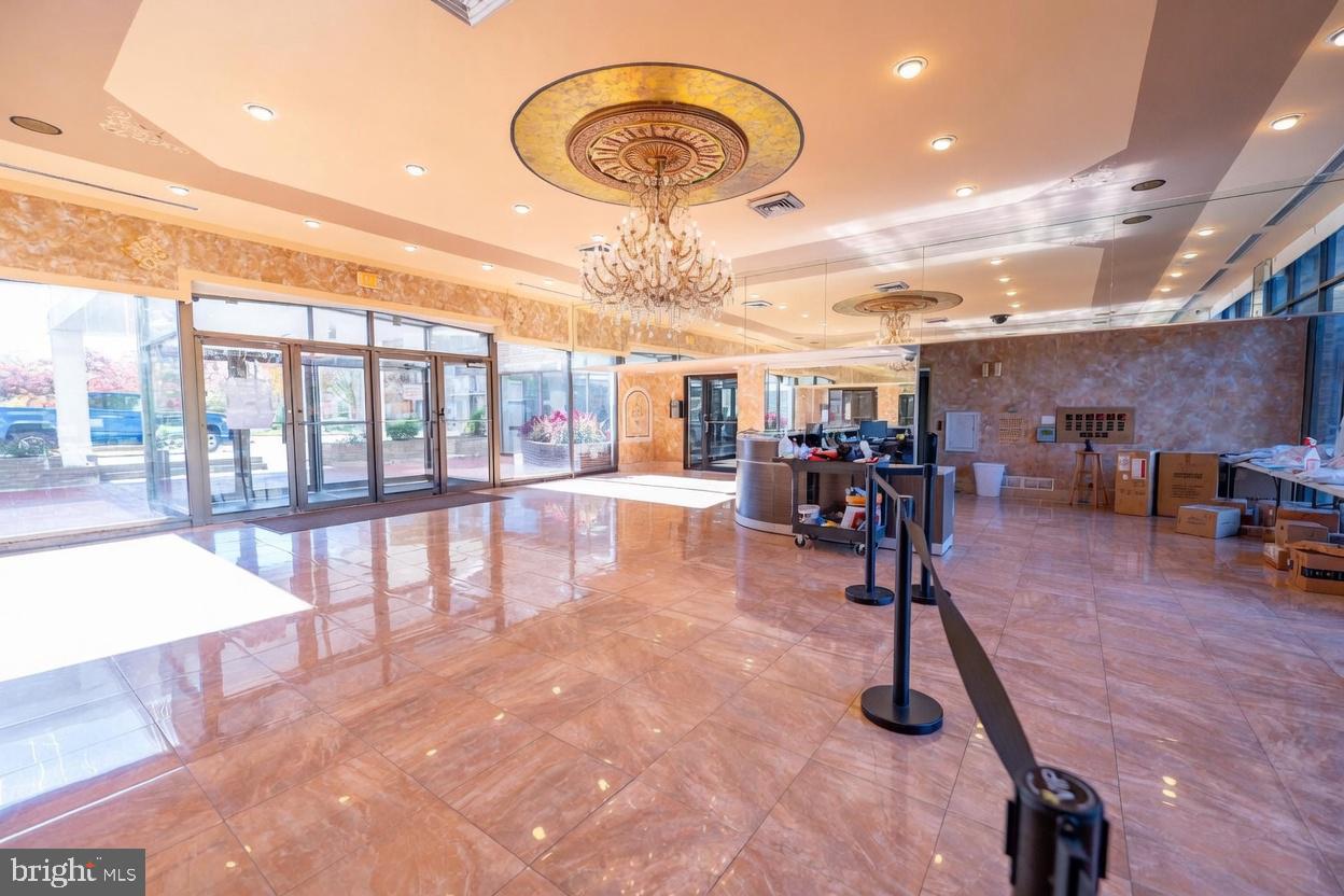 1836 Metzerott Road, Unit 1720 Hyattsville, MD 20783 - Photo 26 of 35 Elegant lobby with stunning chandelier.