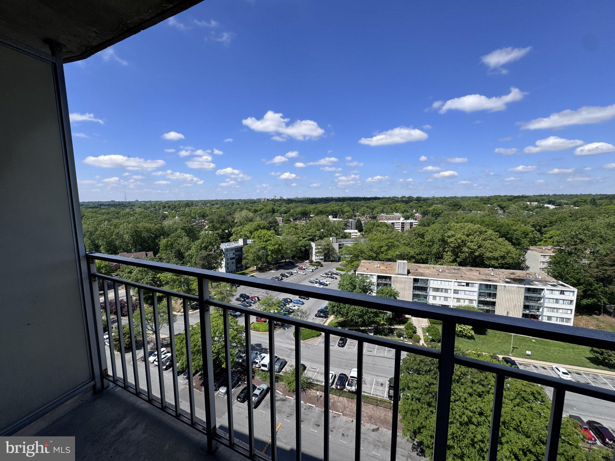 1836 Metzerott Road, Unit 1720 Hyattsville, MD 20783 - Photo 30 of 35 Scenic balcony view of lush greenery.