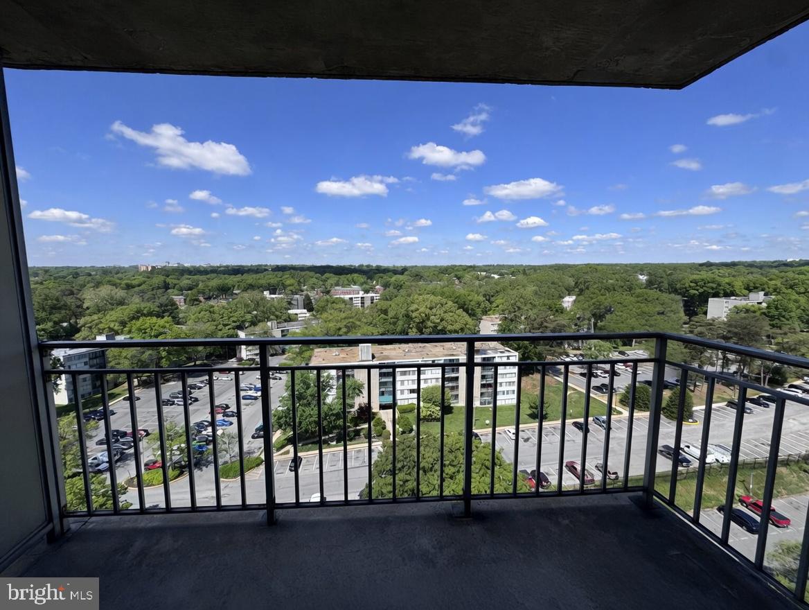 1836 Metzerott Road, Unit 1720 Hyattsville, MD 20783 - Photo 31 of 35 Scenic balcony view of lush greenery.