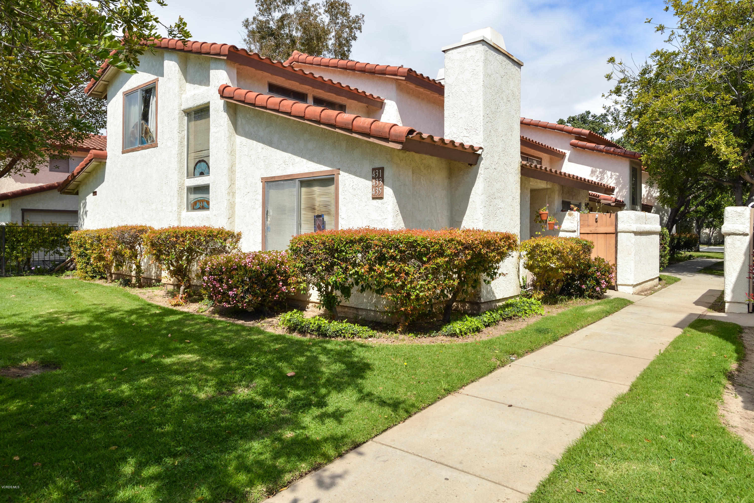 433 Percy Street Oxnard, CA 93033 - Photo 2 of 26 a front view of a house with garden
