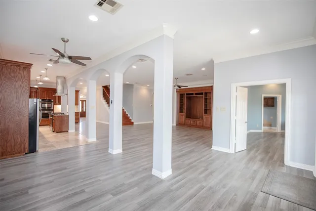 a view of an entryway with wooden floors