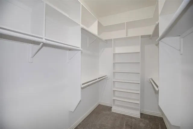 a view of an empty walk in closet