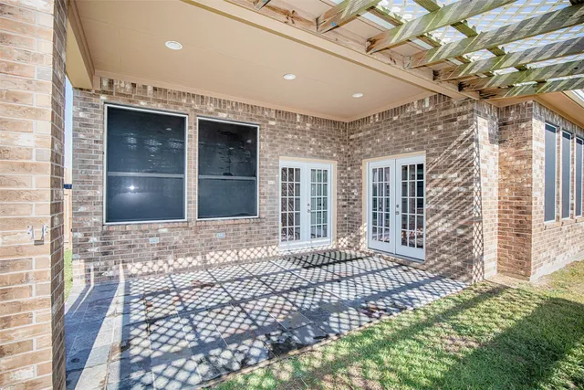 a front view of a house with a yard and porch