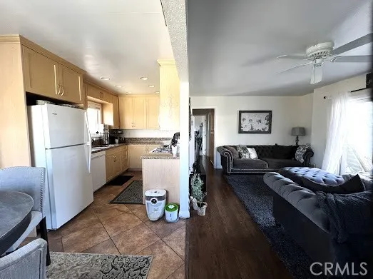 a living room with furniture a couch and wooden floor