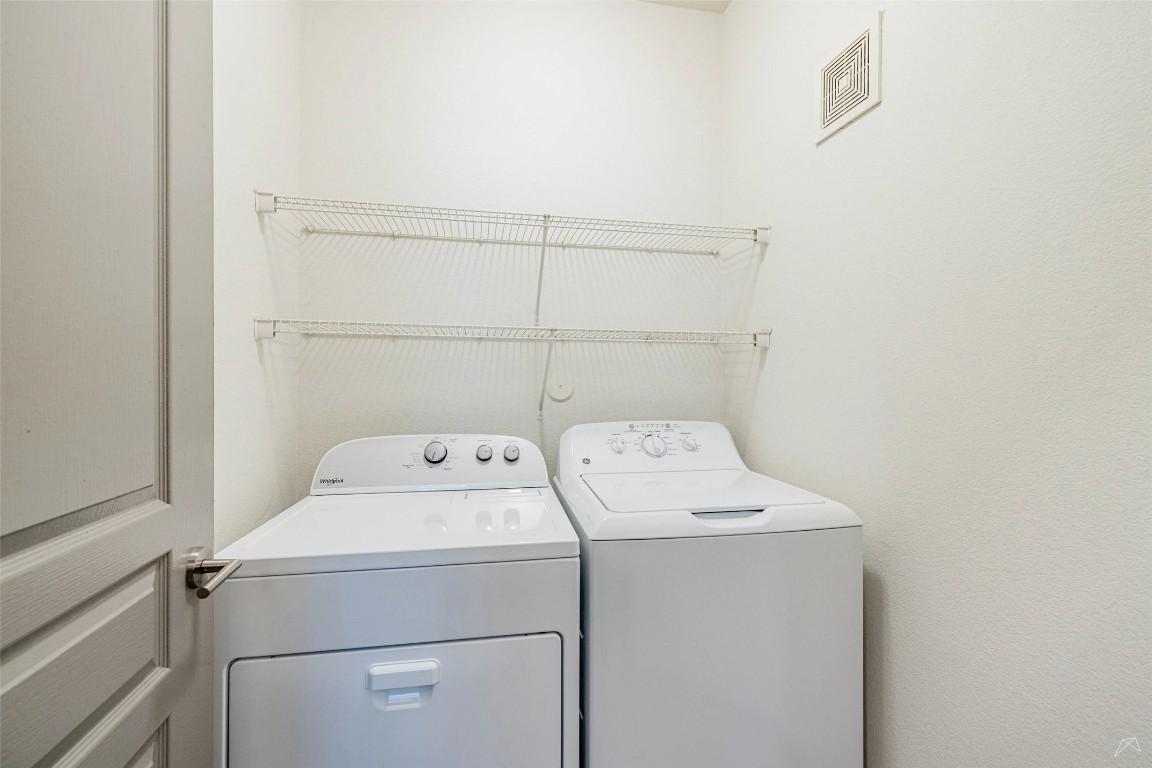 8515 Interstate 35, Unit 11102 Austin, TX 78744 - Photo 13 of 25 Laundry room with washer and clothes dryer