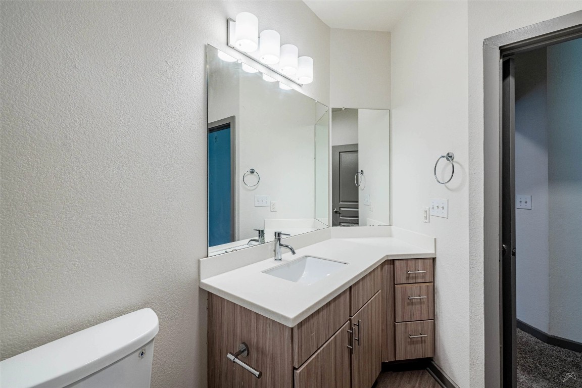 8515 Interstate 35, Unit 11102 Austin, TX 78744 - Photo 14 of 25 Bathroom with vanity and a textured wall