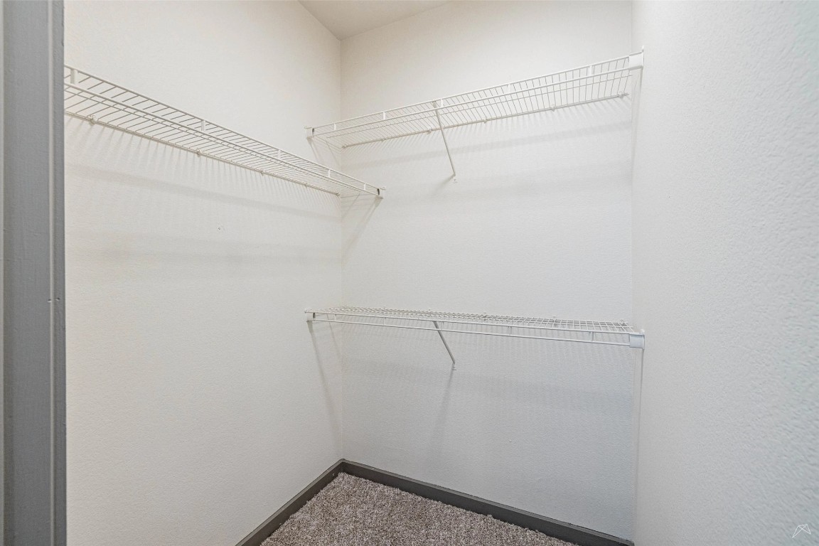 8515 Interstate 35, Unit 11102 Austin, TX 78744 - Photo 15 of 25 Spacious closet with dark carpet