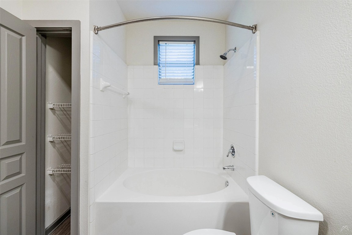 8515 Interstate 35, Unit 11102 Austin, TX 78744 - Photo 17 of 25 Full bath featuring toilet and tub / shower combination