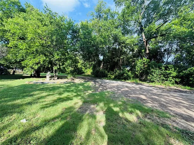 a view of outdoor space with trees all around