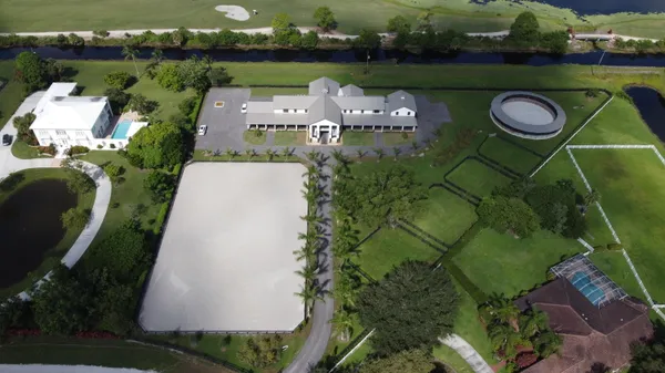 an aerial view of a swimming pool and outdoor space
