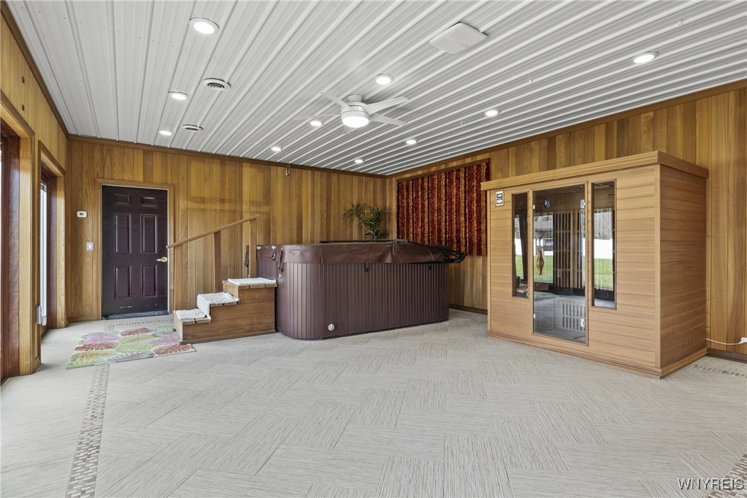 2842 Braley Road Wilson, NY 14131 - Photo 16 of 43 Spa room with hot tub, sauna, radiant floor heatin