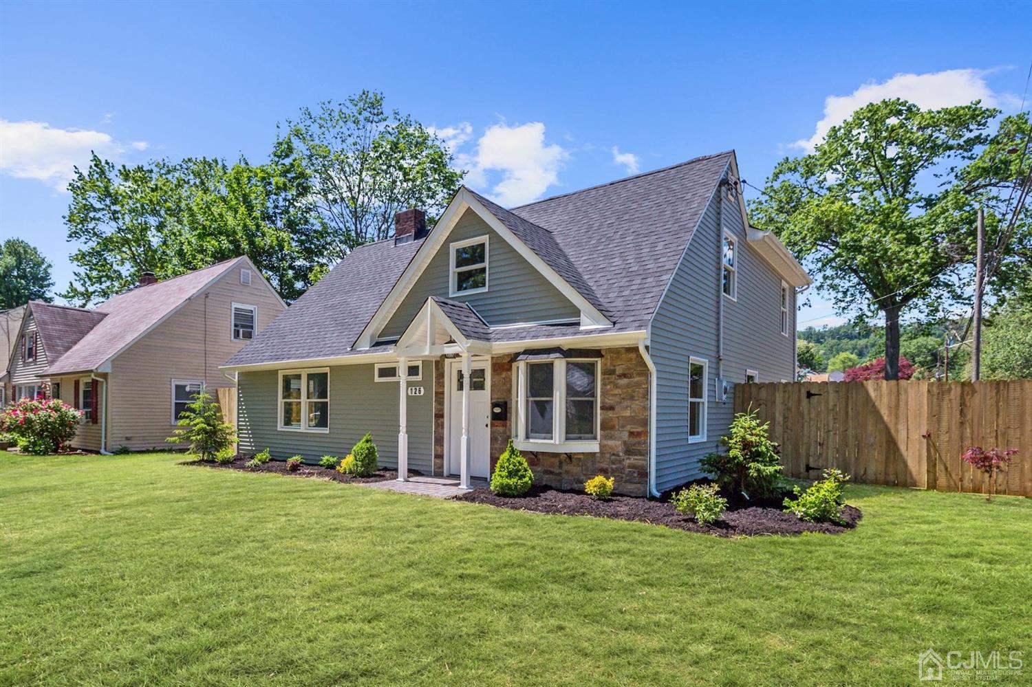 126 Greenbrook Road Green Brook, NJ 08812 - Photo 1 of 36 a front view of house with yard and green space