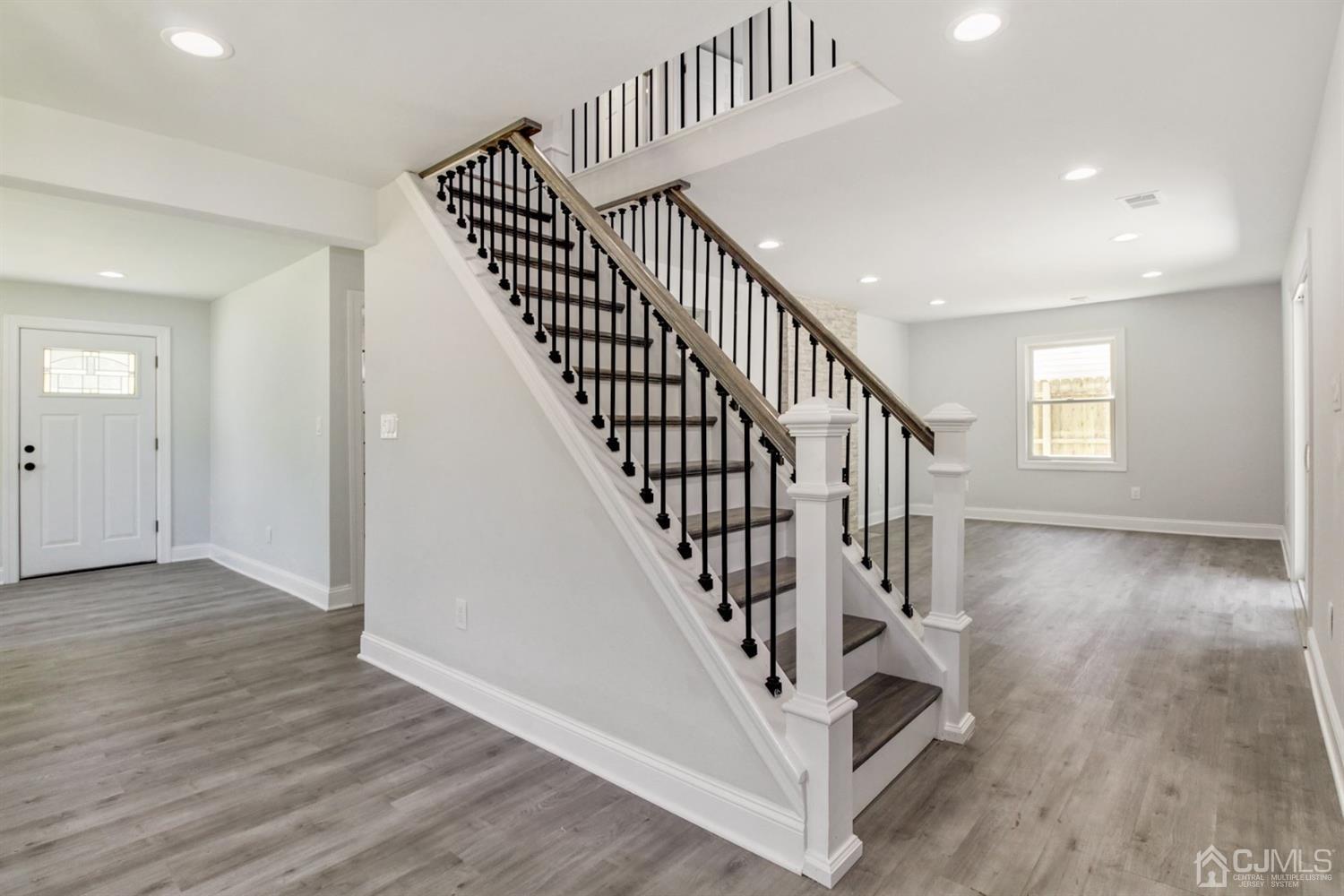 126 Greenbrook Road Green Brook, NJ 08812 - Photo 20 of 36 a view of entryway with wooden floor and stairs