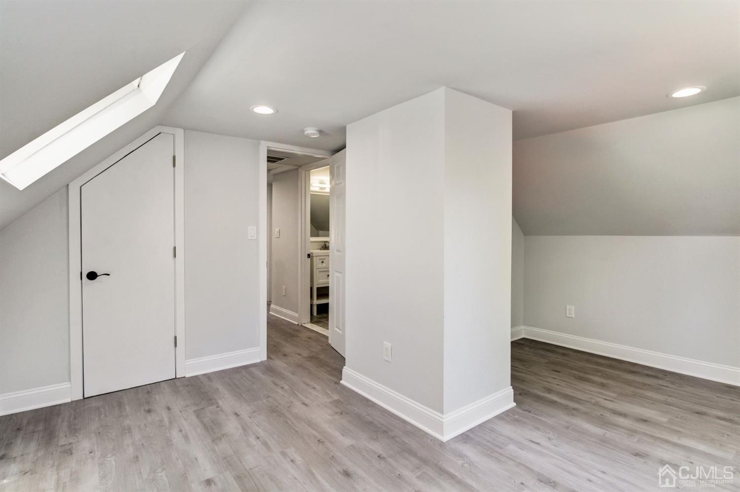126 Greenbrook Road Green Brook, NJ 08812 - Photo 25 of 36 a view of an empty room with wooden floor