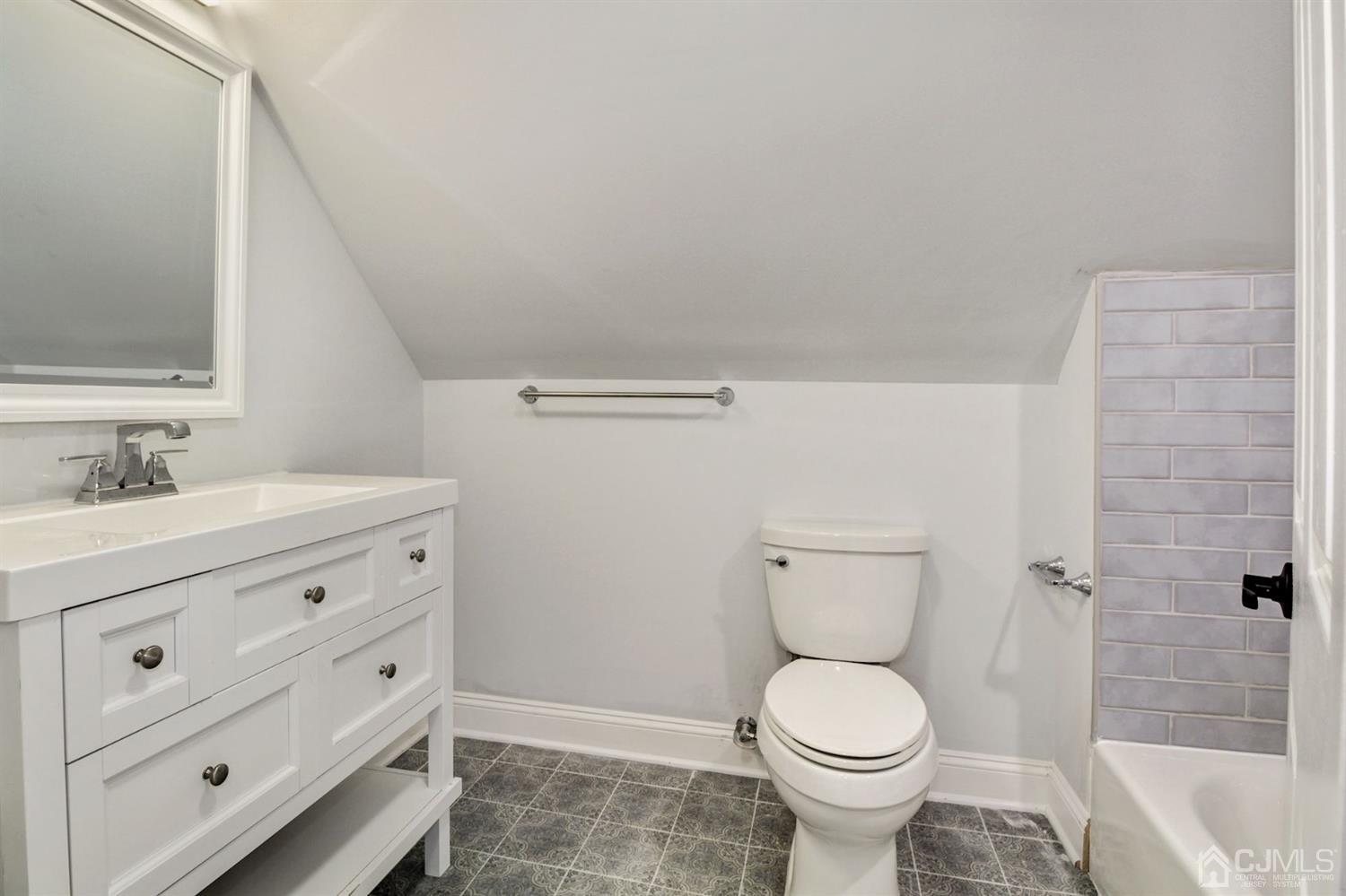 126 Greenbrook Road Green Brook, NJ 08812 - Photo 27 of 36 a bathroom with a toilet sink and mirror