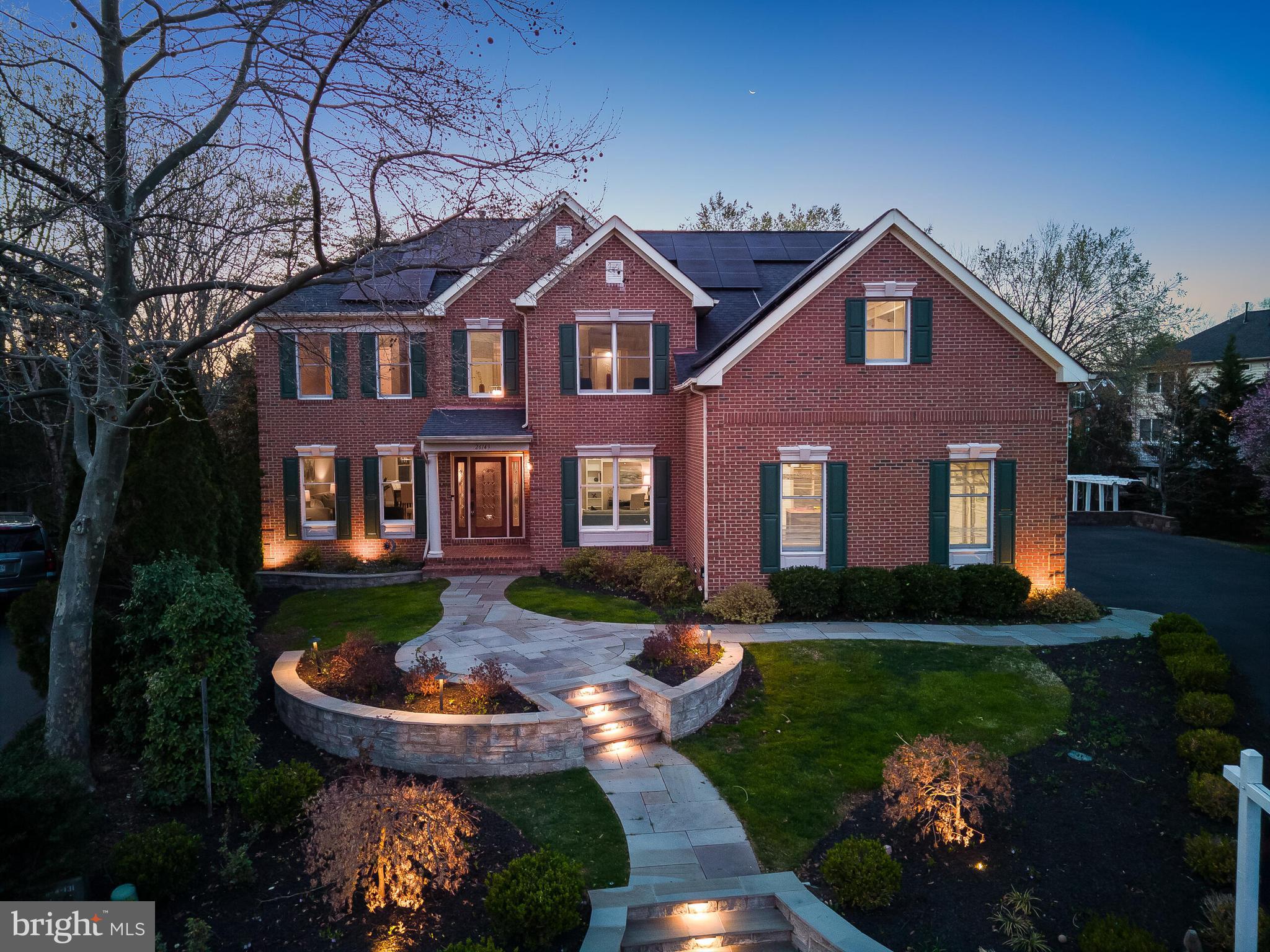 26149 Sealock Lane Chantilly, VA 20152 - Photo 1 of 50 a front view of a house with garden