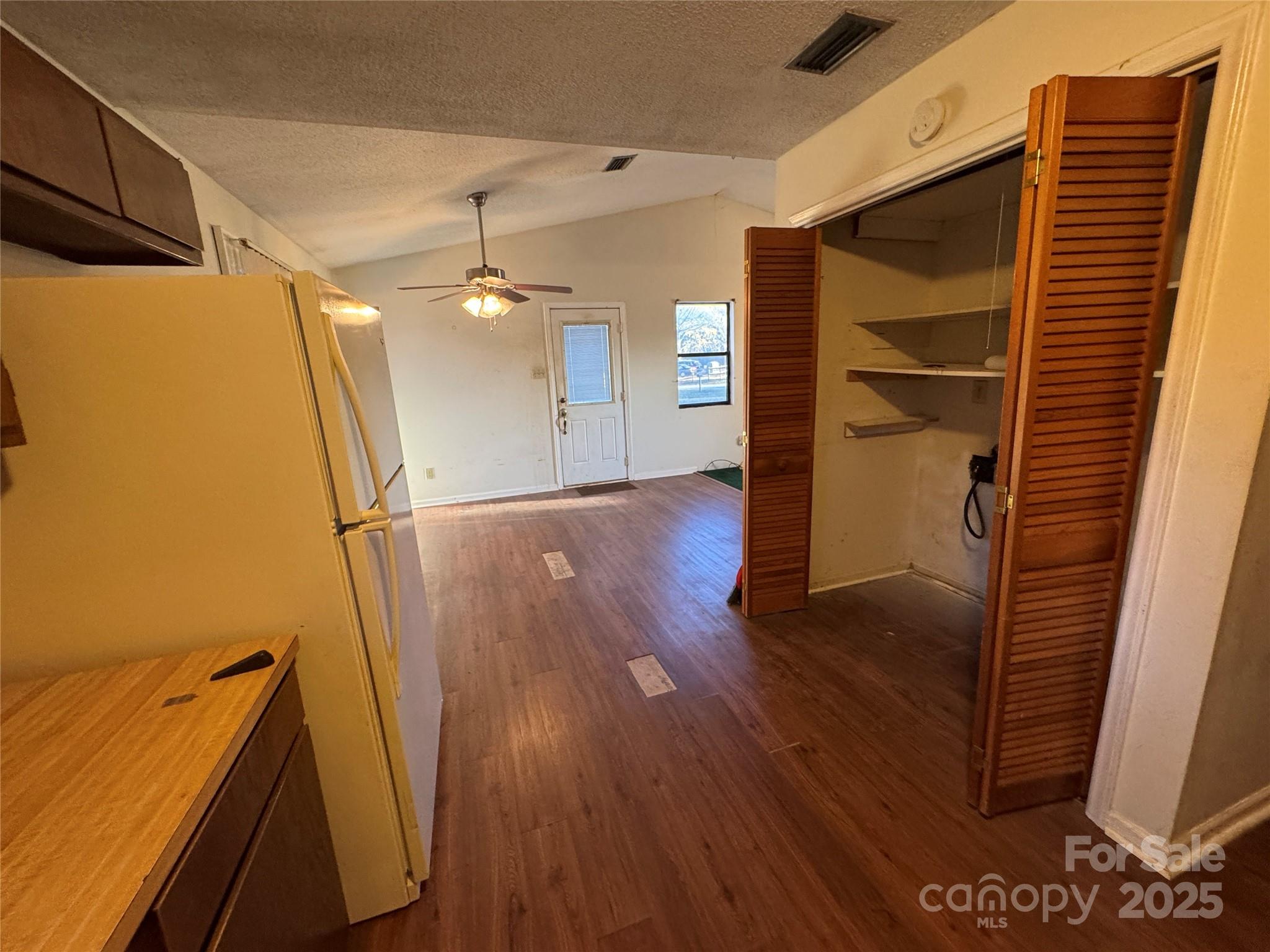 4770 Needmore Road Woodleaf, NC 27054 - Photo 6 of 19 a view of a hallway with wooden floor