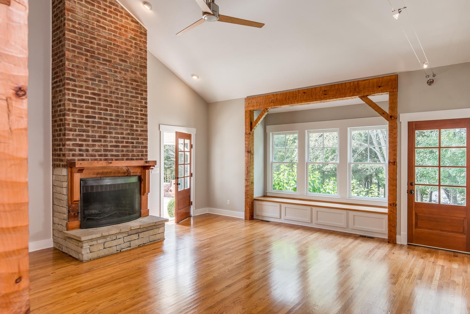 1091 Tulloss Road Franklin, TN 37067 - Photo 14 of 52 a view of an empty room with wooden floor fireplace and a window