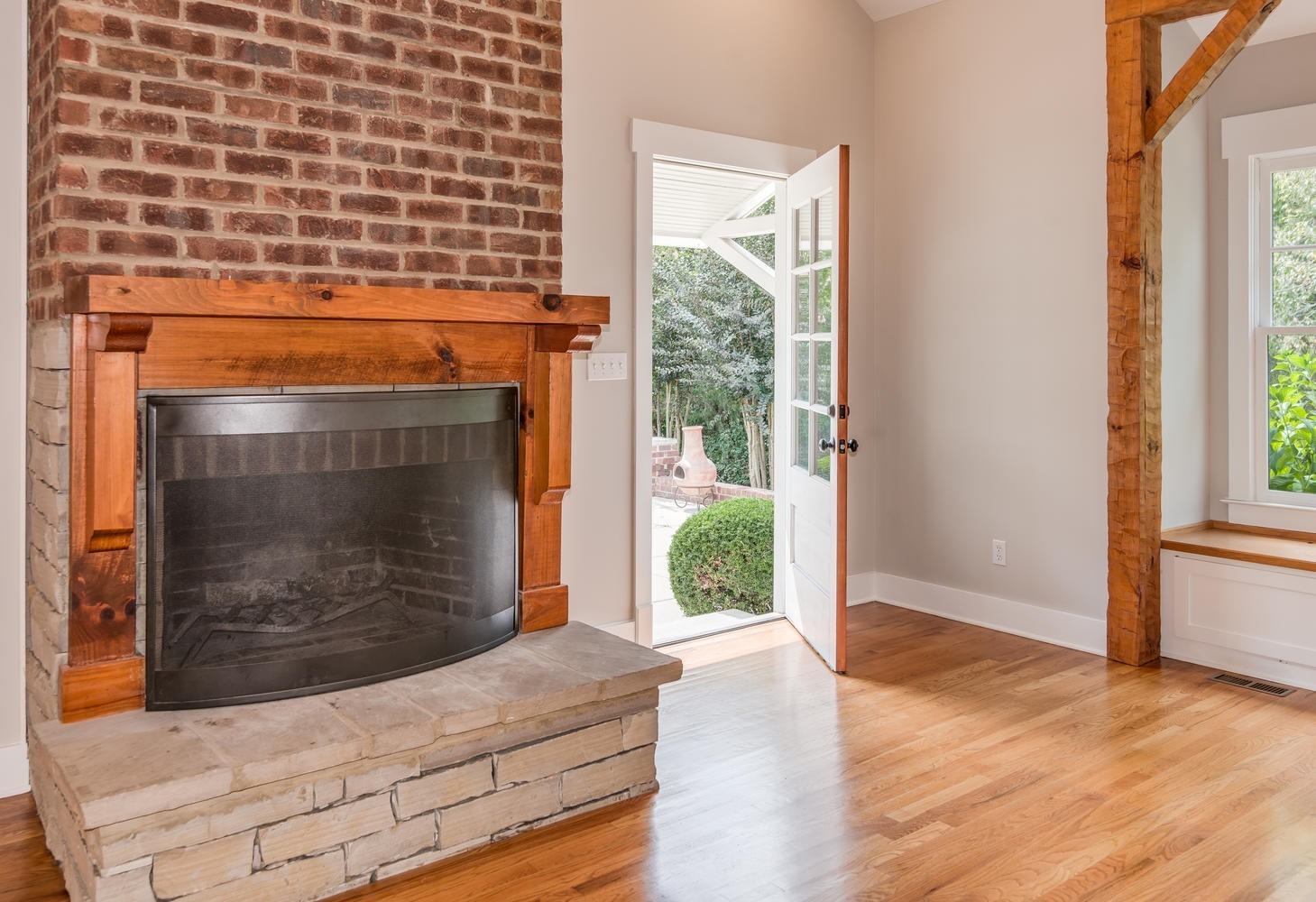 1091 Tulloss Road Franklin, TN 37067 - Photo 17 of 52 a living room with a fireplace and a floor to ceiling window
