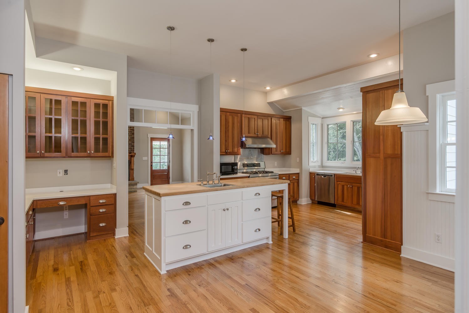 1091 Tulloss Road Franklin, TN 37067 - Photo 20 of 52 a large kitchen with stainless steel appliances granite countertop a large stove a sink dishwasher and a refrigerator with wooden floor