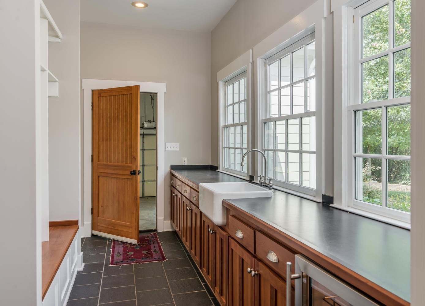 1091 Tulloss Road Franklin, TN 37067 - Photo 25 of 52 a hallway with windows and chandelier