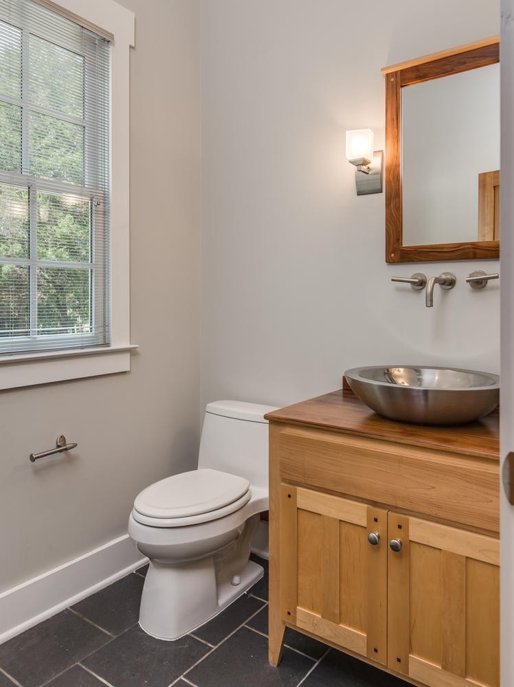 1091 Tulloss Road Franklin, TN 37067 - Photo 27 of 52 a bathroom with a toilet sink and mirror