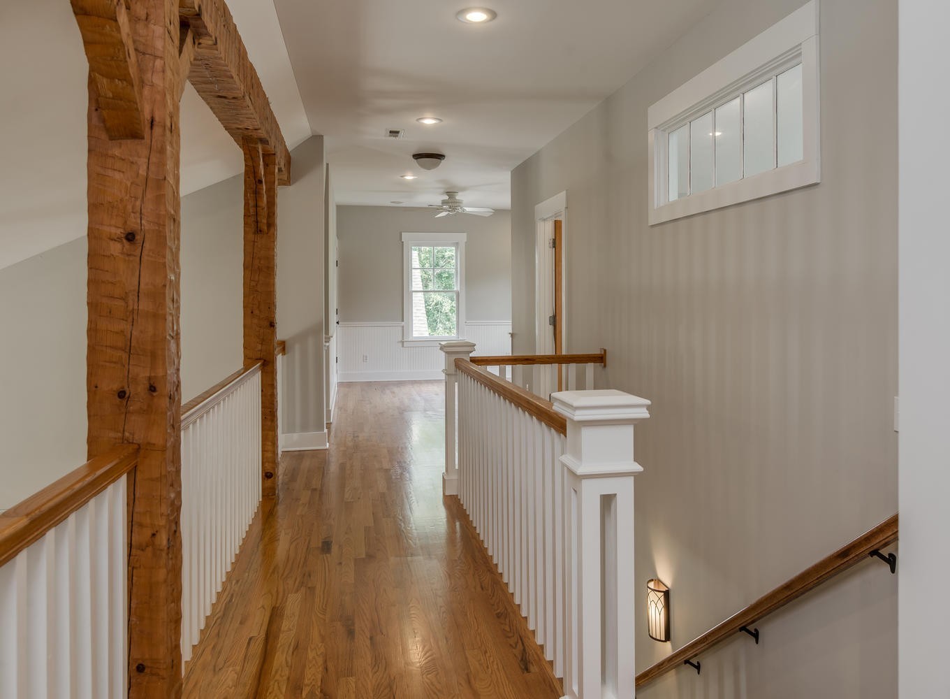 1091 Tulloss Road Franklin, TN 37067 - Photo 34 of 52 a view of a hallway with wooden floor and staircase