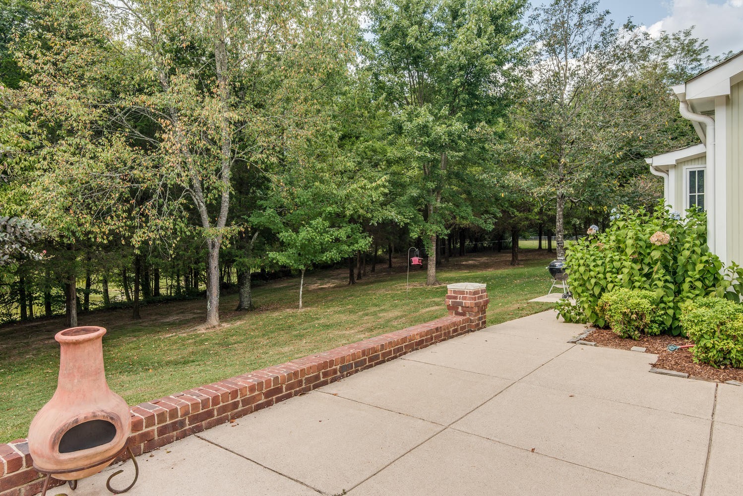 1091 Tulloss Road Franklin, TN 37067 - Photo 45 of 52 a backyard of a house with lots of green space