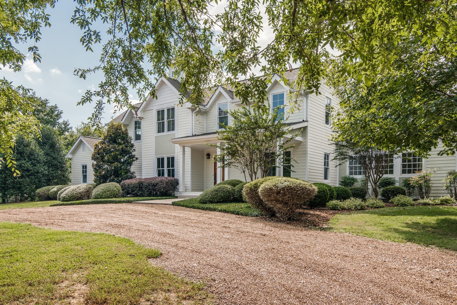 1091 Tulloss Road Franklin, TN 37067 - Photo 6 of 52 a house with a tree in front of it