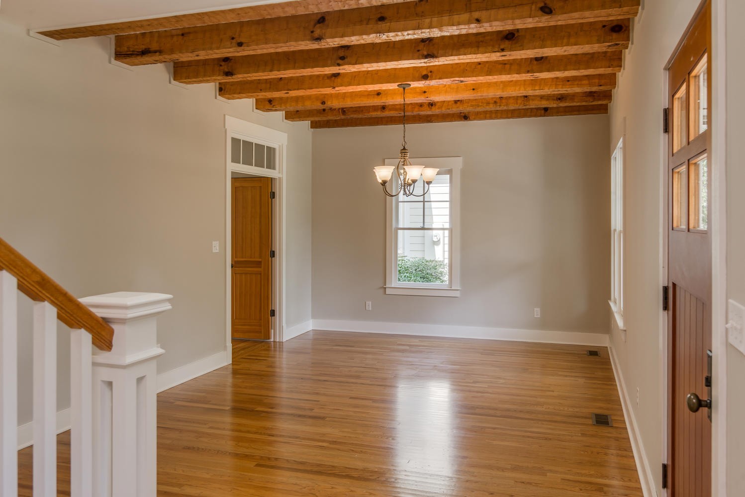 1091 Tulloss Road Franklin, TN 37067 - Photo 10 of 52 a view of an empty room with wooden floor and a window