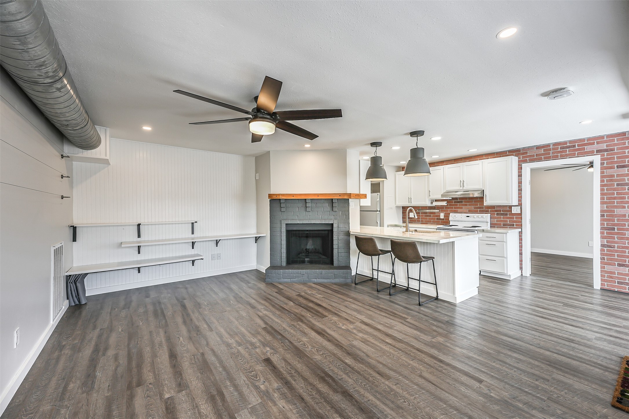 1500 Bay Area Boulevard, Unit 294 Houston, TX 77058 - Photo 35 of 36 a view of a kitchen with furniture and a fireplace