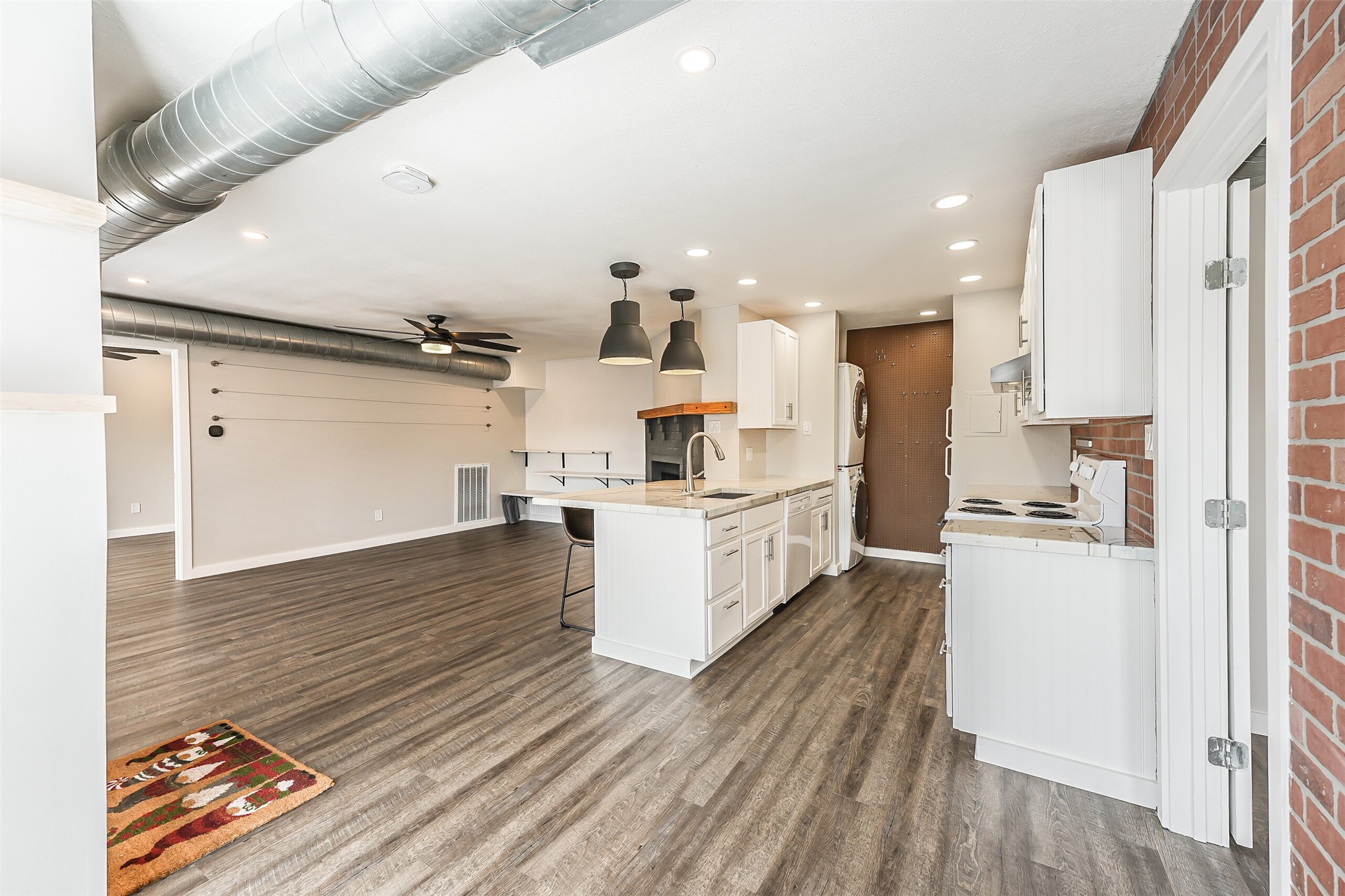 1500 Bay Area Boulevard, Unit 294 Houston, TX 77058 - Photo 2 of 36 a kitchen with stainless steel appliances a refrigerator and wooden floor