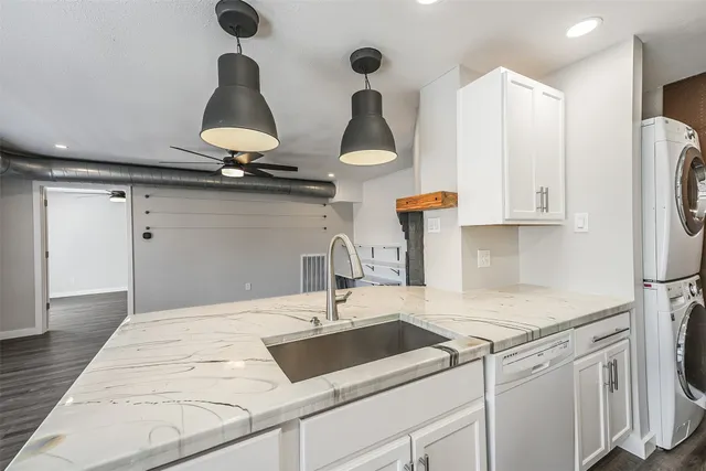 a kitchen with stainless steel appliances a sink stove and refrigerator