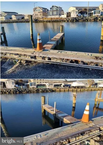a view of a roof deck with two chairs and wooden floor