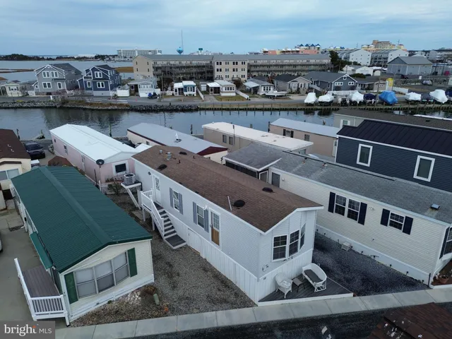 an aerial view of a house with a lake view