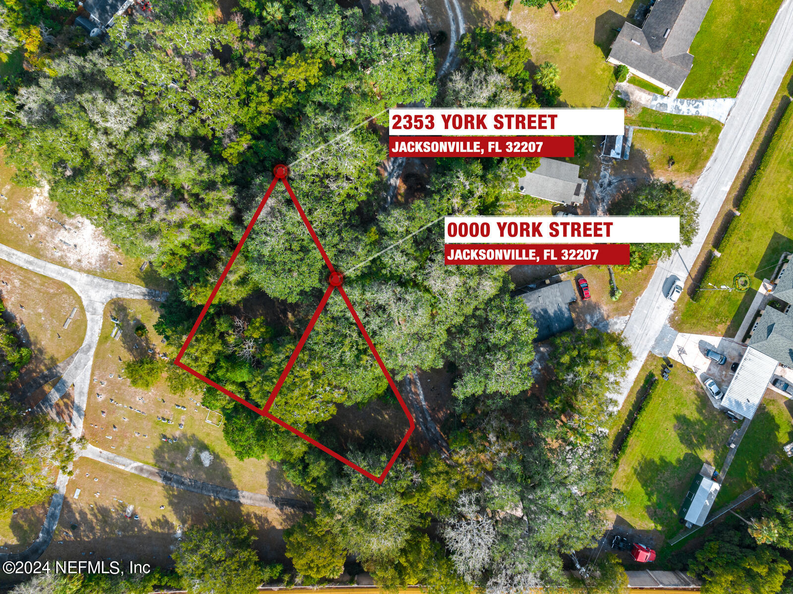 a sign that is sitting in a lot of flowers