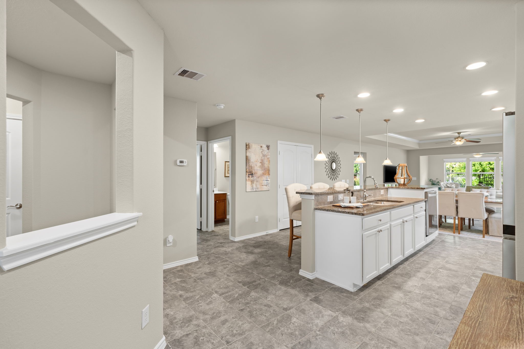 330 Ranch House Lane Richmond, TX 77469 - Photo 9 of 45 a large kitchen with a sink and refrigerator