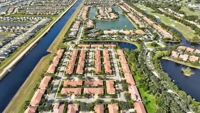 a swimming pool with outdoor seating and yard