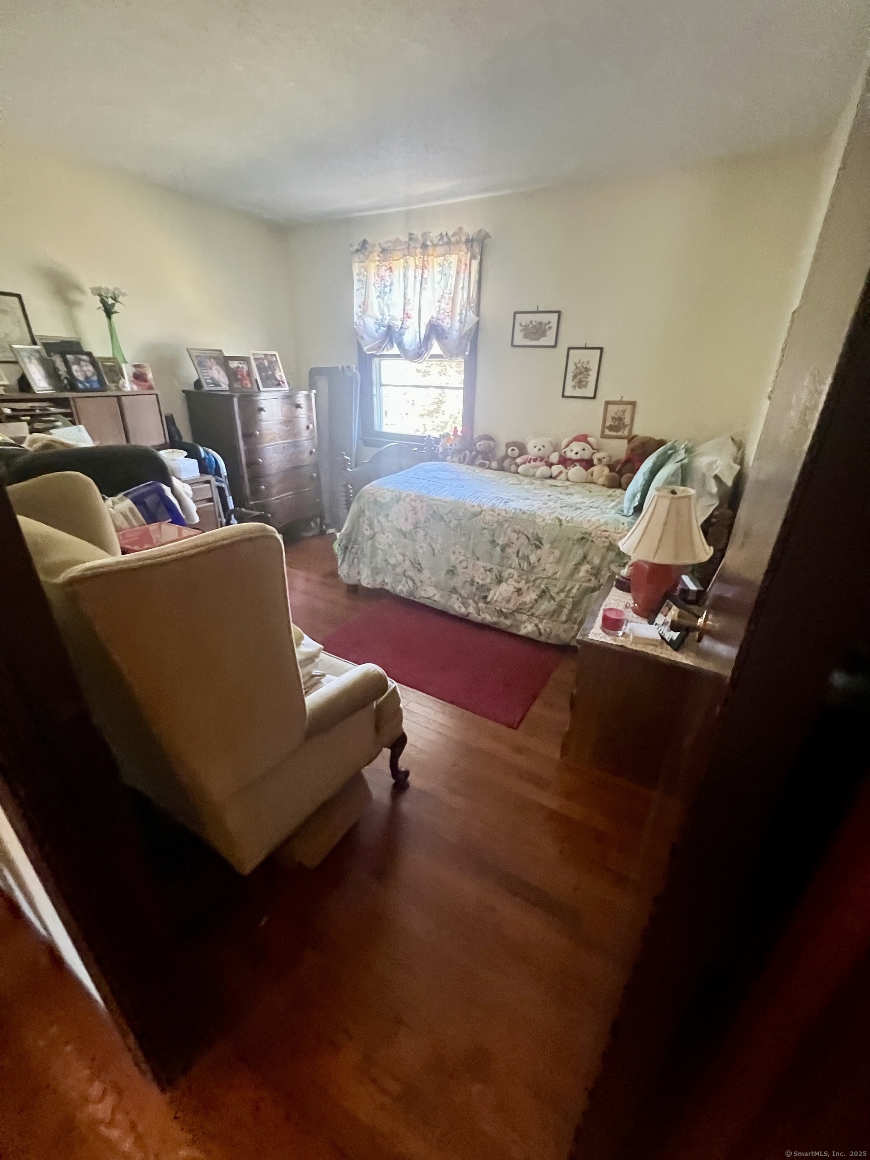268 Fox Hill Road Wethersfield, CT 06109 - Photo 11 of 25 a bedroom with bed couch and window