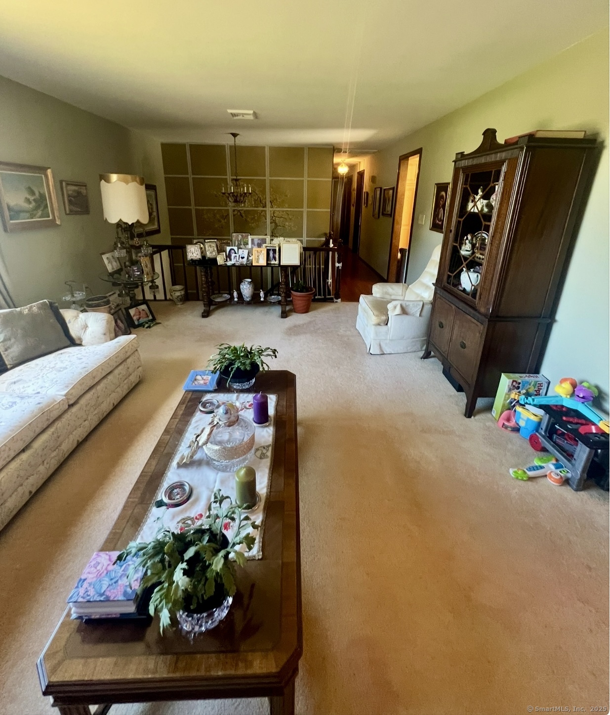 268 Fox Hill Road Wethersfield, CT 06109 - Photo 5 of 25 a living room with furniture and a floor to ceiling window
