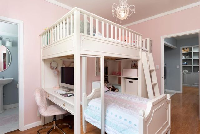 a view of living room with furniture and a chandelier