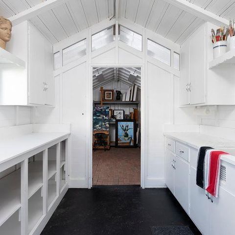 a kitchen with cabinets and a stove